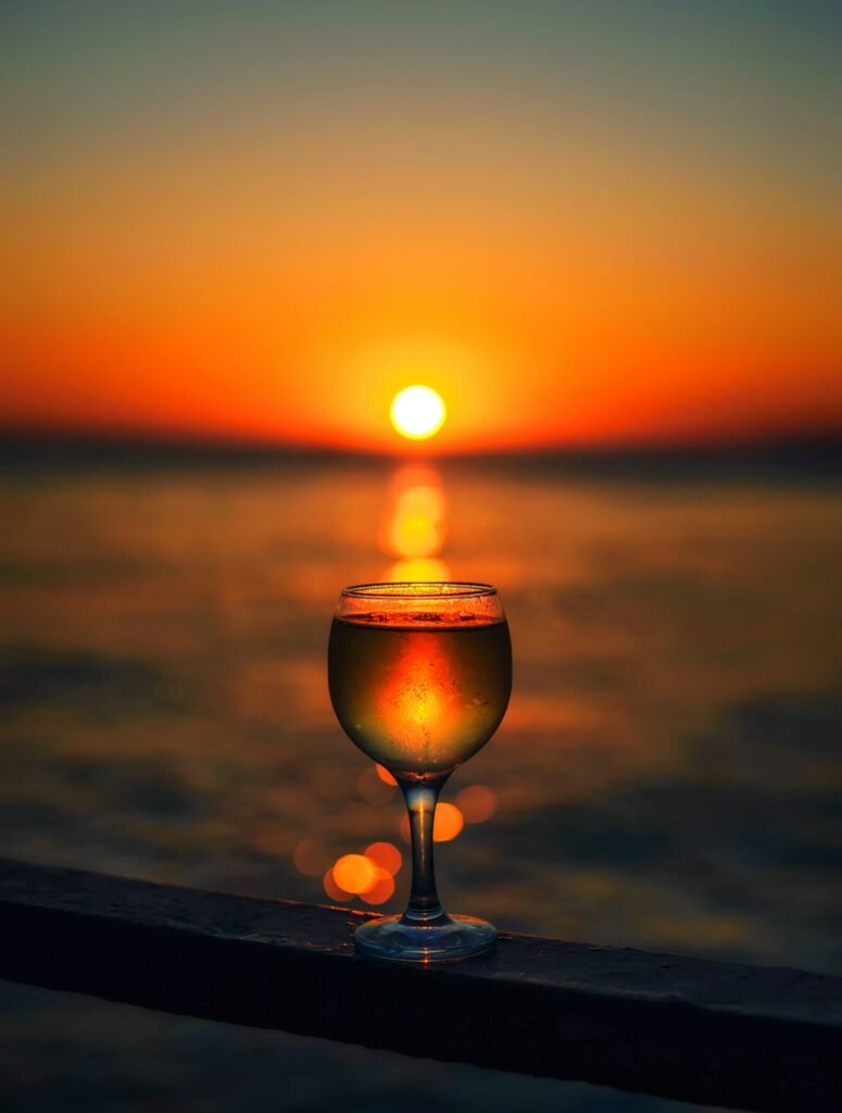 BEAUTIFUL SUNSET ON THE SEA. SUN IN A GLASS