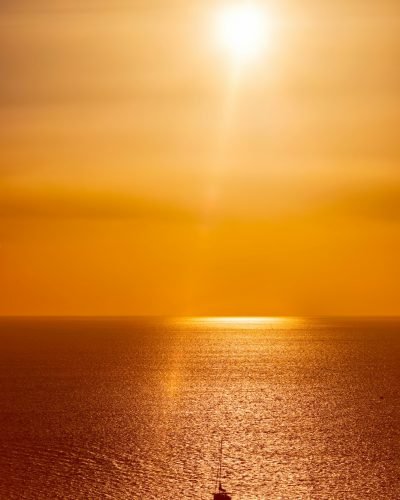 Yacht silhouettes in Aegean sea on sunset